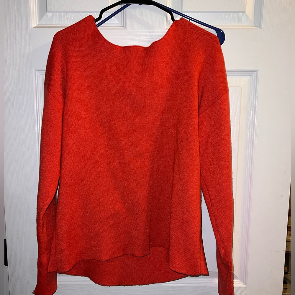 Orange sweater with tie details on back